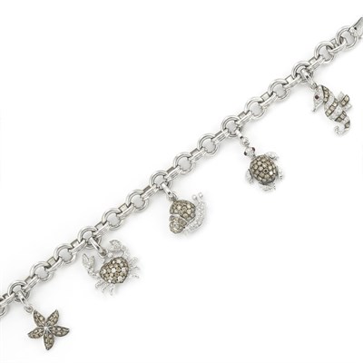 Lot 121 - White Gold, Brown Diamond, Diamond and Ruby Charm Bracelet