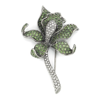 Lot 542 - Blackened Gold, Green Garnet and Diamond Flower Brooch