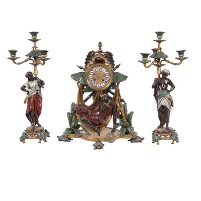Lot 498 - Cold Painted Metal Clock Garniture In the...