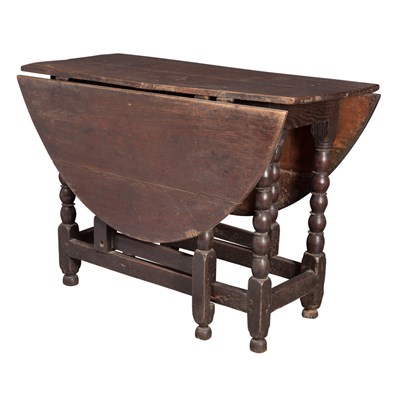 Lot 465 - Carolean Oak Drop-Leaf Table The two-plank...