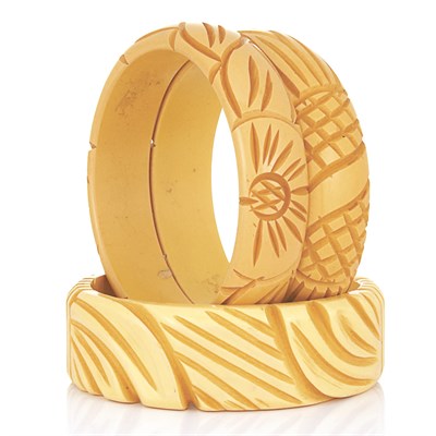 Lot 83 - Three Carved Bakelite Bangle Bracelets