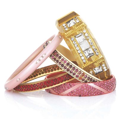 Lot 29 - Five Celluloid and Rhinestone Bangle Bracelets
