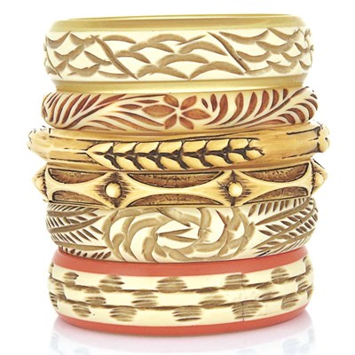 Lot 24 - Six Carved Bakelite and Celluloid Bangle Bracelets