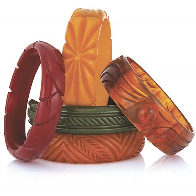 Lot 12 - One Celluloid and Four Bakelite Bangle Bracelets