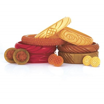 Lot 1 - Seven Carved Bakelite Bangle Bracelets and Three Pairs of Earclips