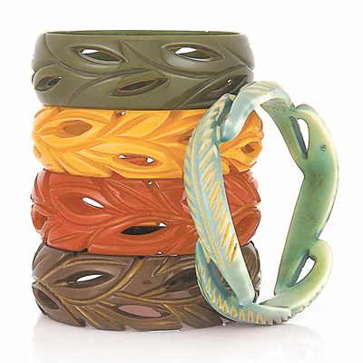 Lot 85 - One Carved Celluloid and Four Carved Bakelite Bangle Bracelets