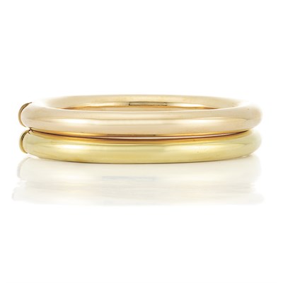 Lot 429 - Pair of Two-Color Gold Bangle Bracelets