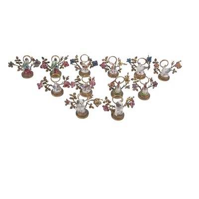 Lot 1236 - Set of Twelve French Gilt-Bronze and Porcelain...