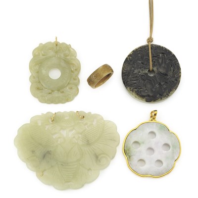 Lot 22 - Four Carved Jade Pendants and Brown Jade Band Ring