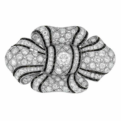 Lot 556 - Art Deco Platinum, Diamond and Black Onyx Bow Brooch