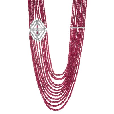 Lot 233 - Twelve Strand Ruby Bead, White Gold and Diamond Necklace