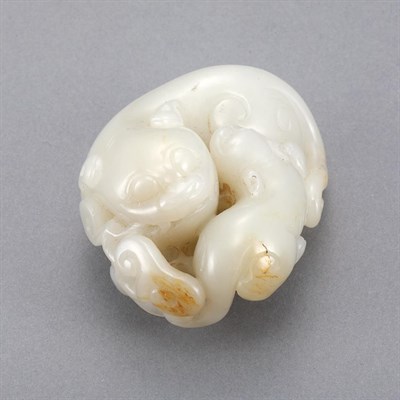 Lot 410 - Chinese Celadon Jade Lion Group The female...