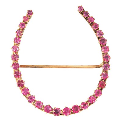 Lot 27 - Gold and Ruby Horseshoe Brooch