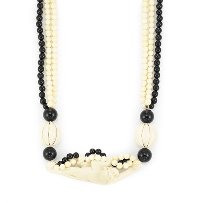 Lot 801 - Triple Strand Ivory and Black Onyx Bead Necklace with Carved Ivory Monkey Pendant
