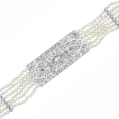 Lot 521 - Edwardian Six Strand Pearl, Platinum and Diamond Bracelet