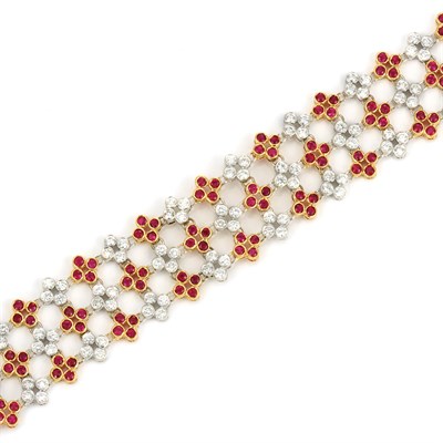 Lot 629 - Two-Color Gold, Diamond and Ruby Floret Bracelet