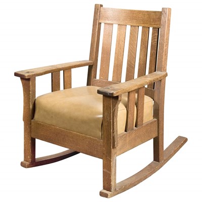 Lot 346 - Arts and Crafts Oak Rocker The curved crest...
