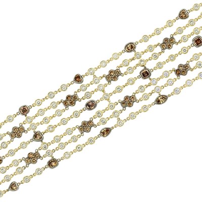 Lot 466 - Seven Strand Gold, Blackened Gold, Yellow and Brown Diamond Bracelet