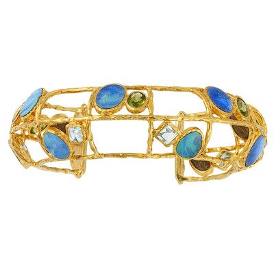 Lot 191 - Silver-Gilt, Opal Doublet, Peridot and Blue Topaz Cuff Bangle Bracelet