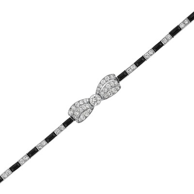 Lot 528 - Art Deco Platinum, Diamond and Black Onyx Bow Bracelet