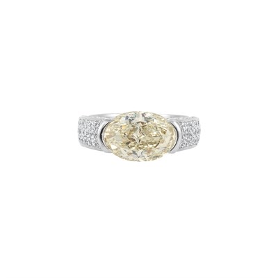 Lot 470 - White Gold, Light Yellow Diamond and Diamond Ring