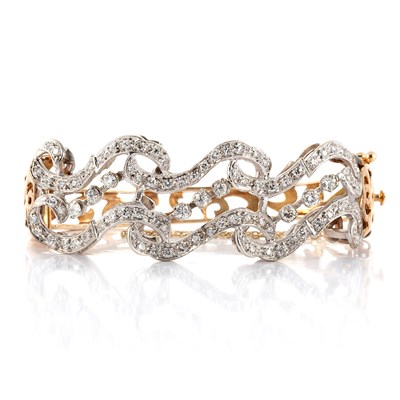 Lot 37 - Two-Color Gold and Diamond Bangle Bracelet