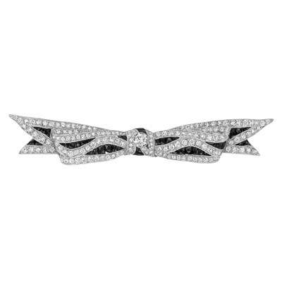Lot 522 - Art Deco Platinum, Diamond and Black Onyx Bow Brooch