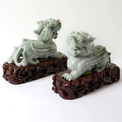 Lot 597 - Pair of Chinese Jade Figures of Winged Lions...