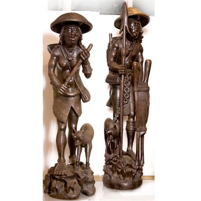Lot 584 - Pair of Tribal Style Carved Wood Figures of...