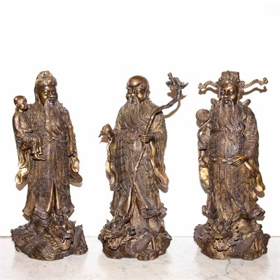 Lot 401 - Set of Three Chinese Patinated-Metal Figures...
