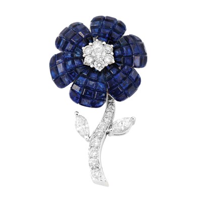 Lot 522 - White Gold, Invisibly-Set Sapphire and Diamond Flower Clip-Brooch