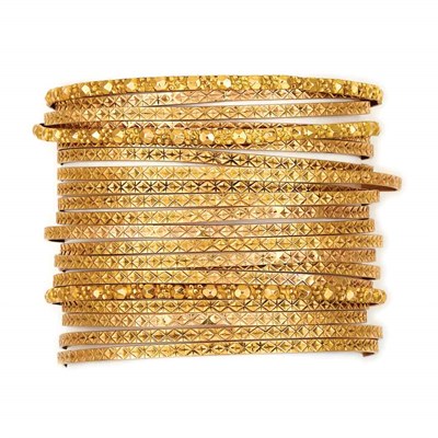 Lot 672 - Twenty-One Gold Bangle Bracelets