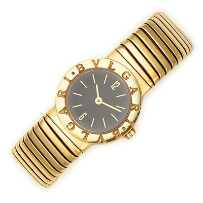 Lot 384 - Lady's Gold Bangle-Watch, Bulgari