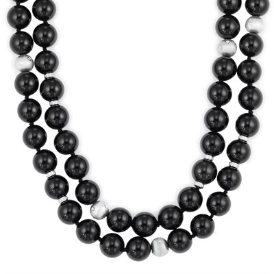 Lot 601 - Long Black Onyx, White Gold and Diamond Bead Necklace