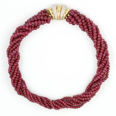 Lot 649 - Seven Strand Ruby Bead Torsade Necklace with Gold and Diamond Clasp