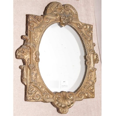 Lot 469 - Baroque Style Brass and Ebonized Repousse...