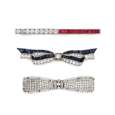 Lot 802 - Two Platinum, Diamond, Sapphire and Seed Pearl Bow Pins and Diamond and Synthetic Ruby Bar Pin