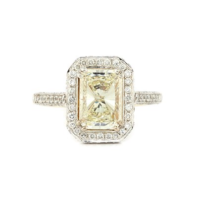 Lot 338 - White Gold, Light Yellow Diamond and Diamond Ring