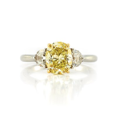 Lot 786 - Platinum, Gold, Fancy Yellow Diamond and Diamond Ring
