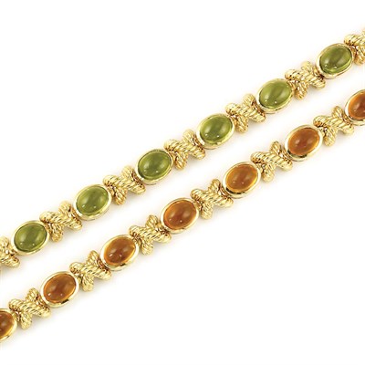 Lot 647 - Pair of Gold, Cabochon Peridot and Citrine Bracelets