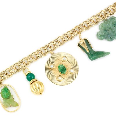Lot 734 - Gold, Carved Jade and Dyed Green Chalcedony Charm Bracelet