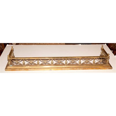 Lot 547 - Regency Brass Fire Fender Length 48 inches.