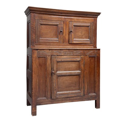 Lot 131 - Queen Anne Oak Cupboard With a pair of paneled...