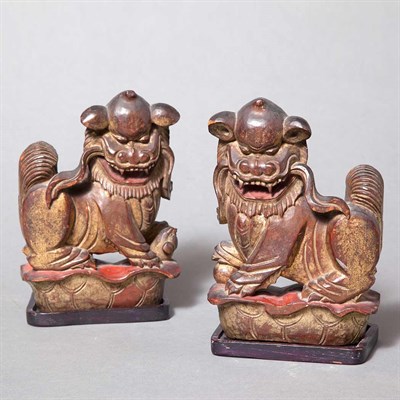 Lot 253 - Pair of Chinese Gilt-Wood Figures of Foo Lions...
