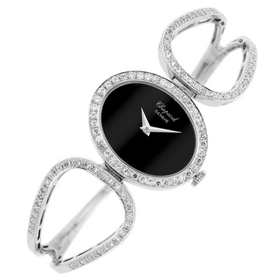 Lot 41 - White Gold, Black Onyx and Diamond Bangle-Watch, Chopard
