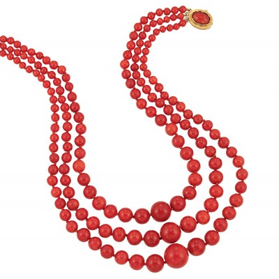 Lot 388 - Triple Strand Oxblood Coral Bead Necklace with Gold and Coral Clasp