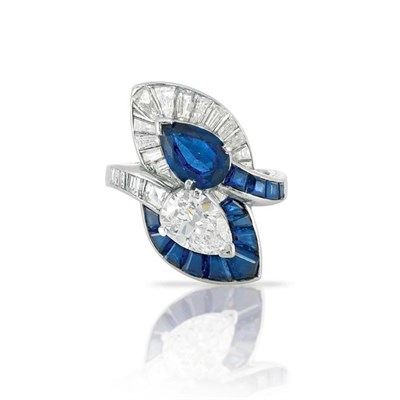 Lot 588 - Platinum, Diamond and Sapphire Crossover Ring