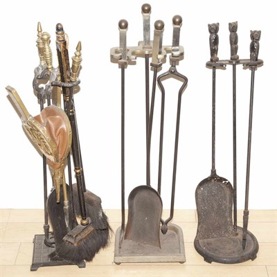 Lot 392 - Three Sets of Iron Firetools on Stands Height...