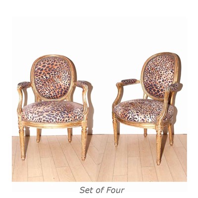Lot 594 - Set of Four Louis XVI Style Carved and Gold...