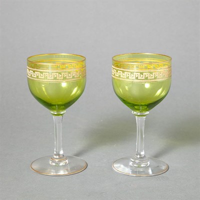 Lot 615 - Gilt Decorated Green Glass Stemware Service...